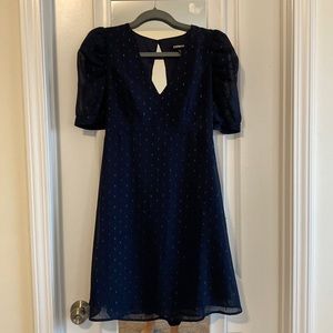 Dark blue dress, beautiful and looking good.